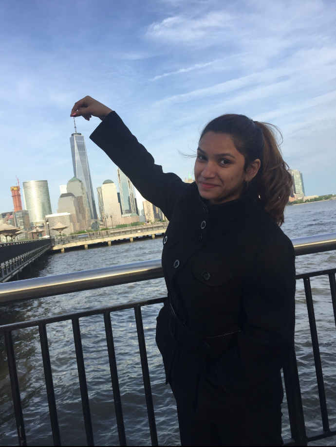 picture of Aditi in front of a water and city scape